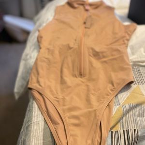 New with tags Skims sleeveless swimsuit.